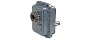 Industrial gear reducer with an output shaft extending to the left, mounted on a gray housing with bolts.