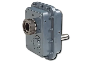 Industrial gear reducer with an output shaft extending to the left, mounted on a gray housing with bolts.