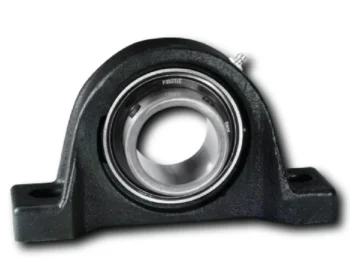 Close-up of a black bearing housing with a silver inner ring, shown from the side in a machining context.
