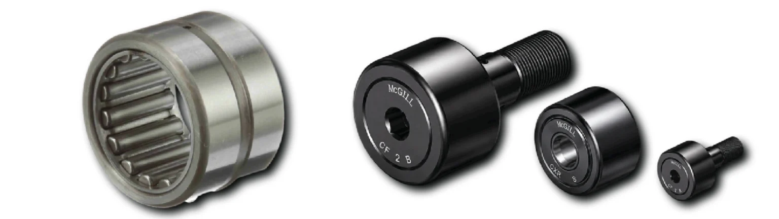 A set of metal bearings and spacers in varying sizes laid out diagonally from left to right.
