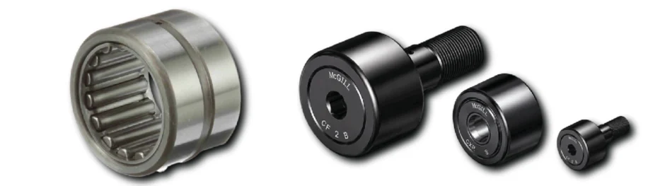 A set of metal bearings and spacers in varying sizes laid out diagonally from left to right.