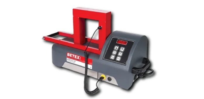 Electric binding machine with red clamping frame and gray base, control panel with keypad for binding documents.