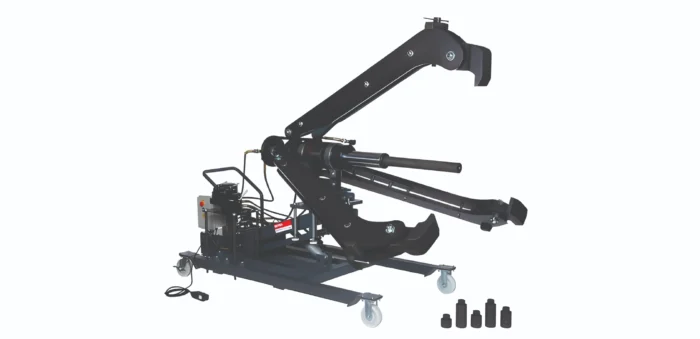Mobile hydraulic articulating crane arm mounted on a wheeled base, shown in side view with control station nearby.