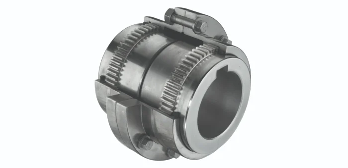 Industrial gear coupling with two toothed rings bolted together to connect shafts (mechanical drive component).