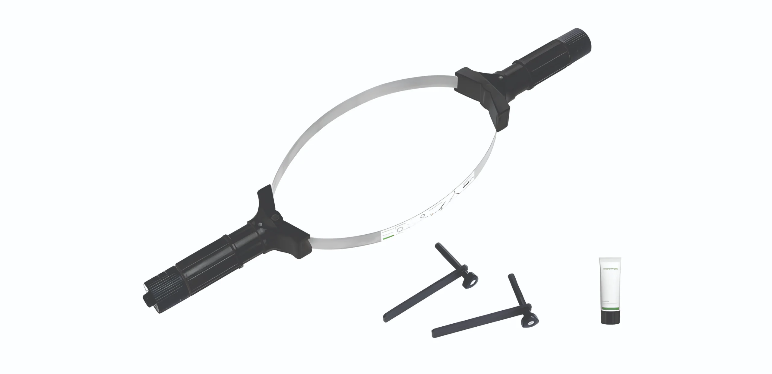 Medical device: circular frame with two black handles and a slender tube, likely a laparoscopic instrument used in minimally invasive surgery.