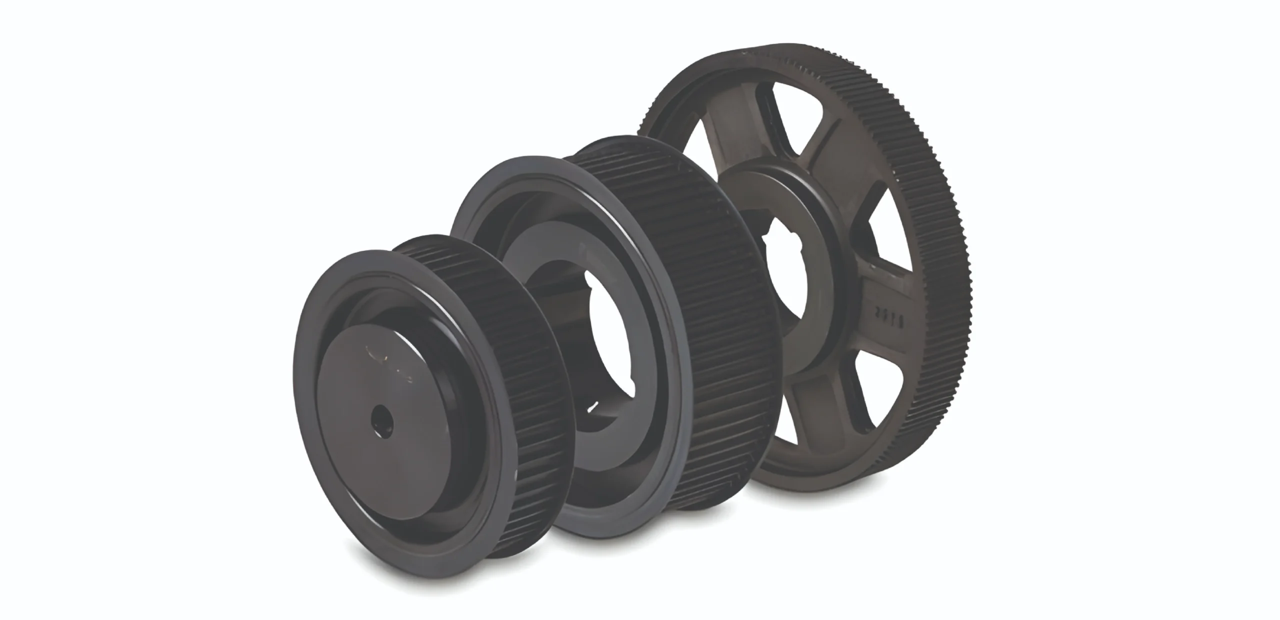 Three black toothed gears arranged in a diagonal row, part of a mechanical gear train.